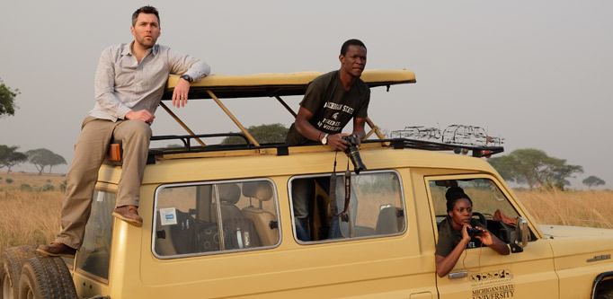 Robert Montgomery, Tutilo Mudumba, and Sophia Jingo on a truck