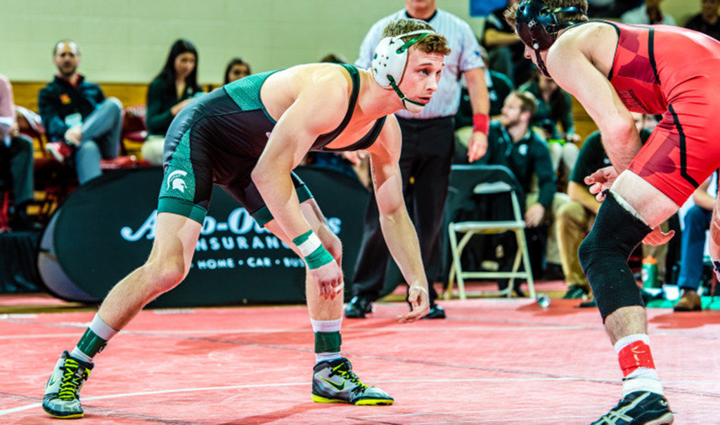 Hughes and Eicher advance to second day at NCAA Wrestling Championships