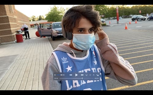 person crossing street with mask on face