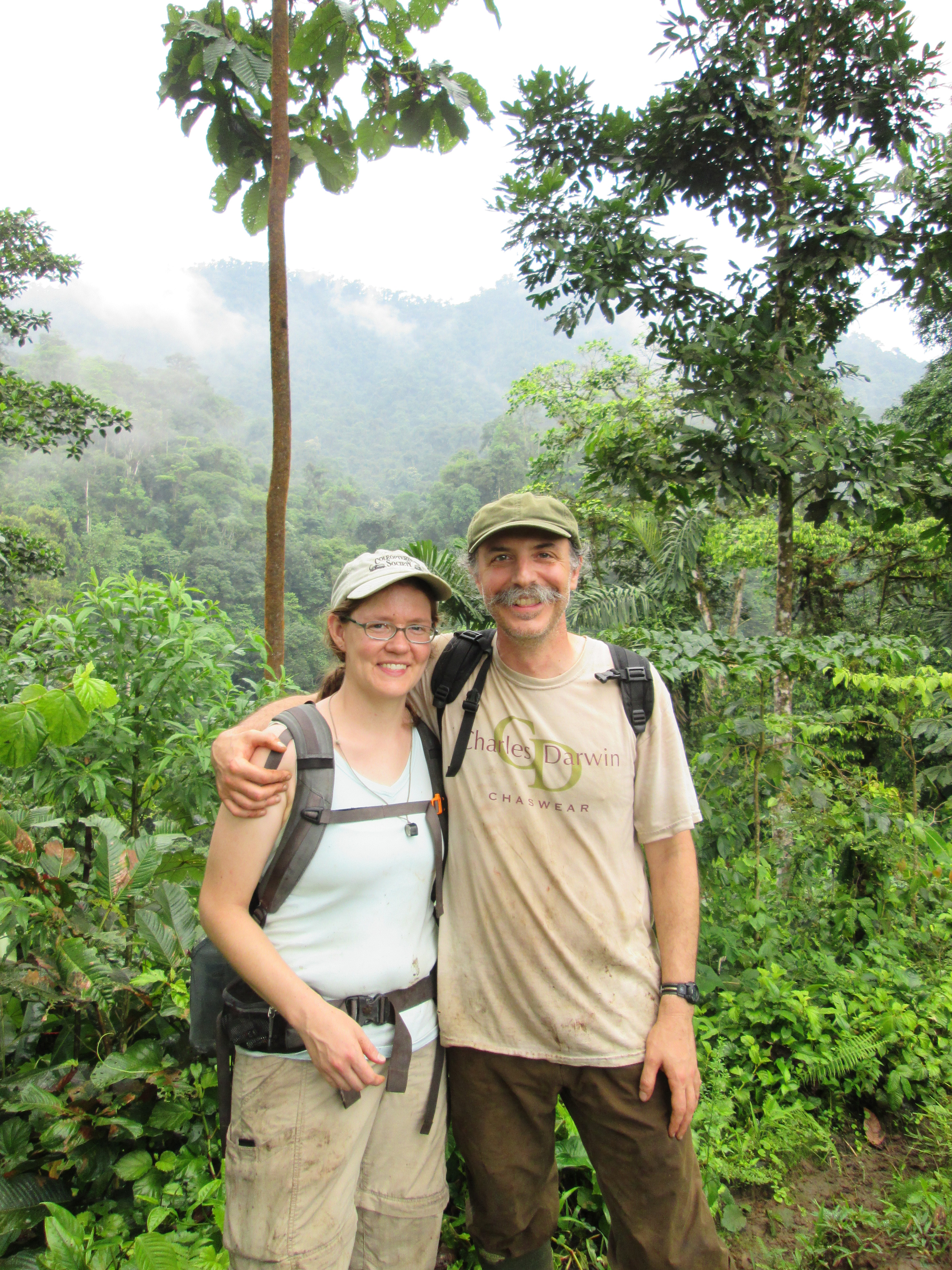 Sarah Smith and Anthony Cognato are photographed in front of dense green foliage and misty hilltops in Ecuador in 2015.
