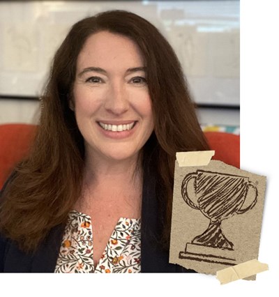 Michele Brock, with an image of a trophy drawn on brown paper