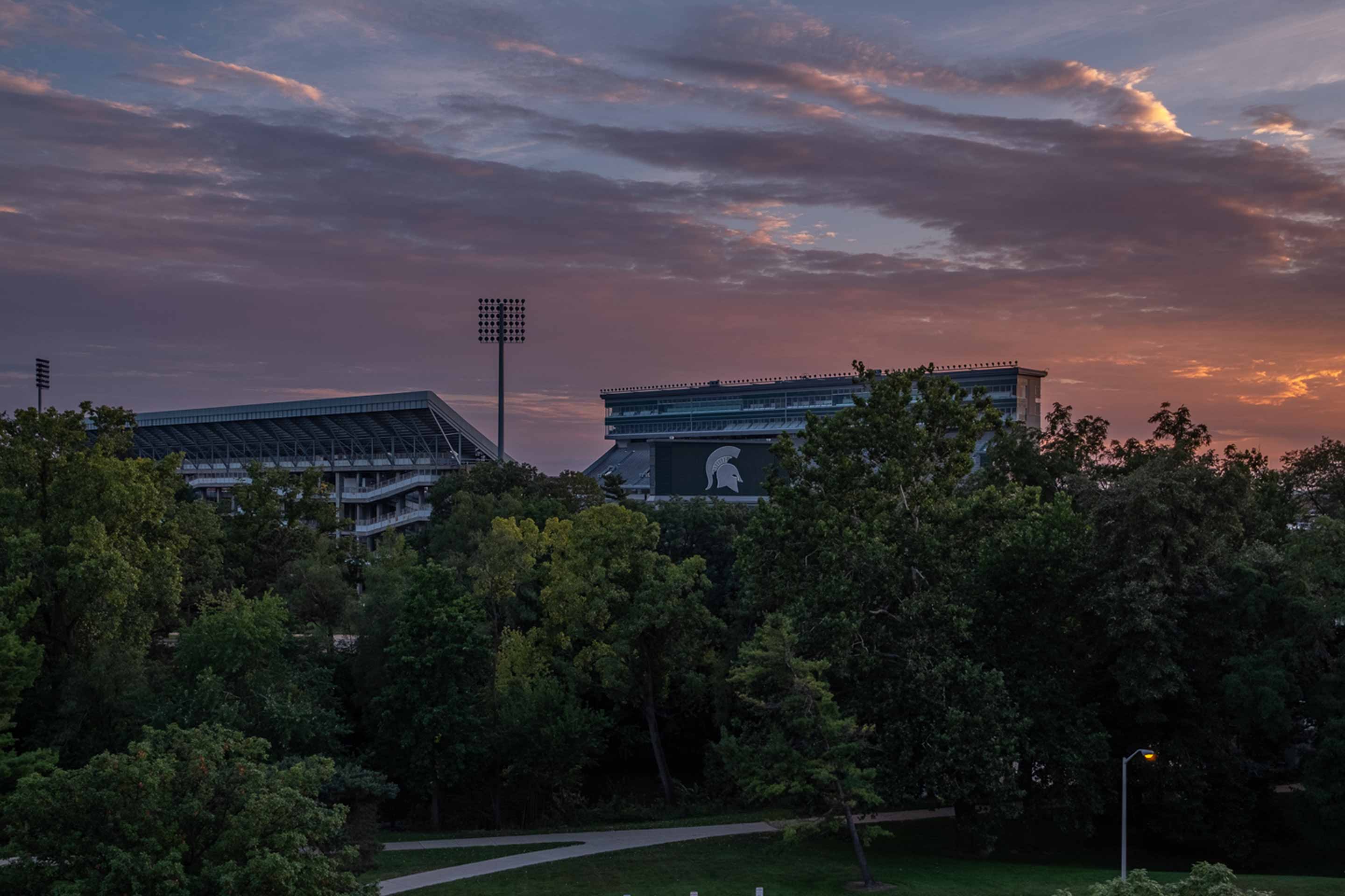 Spartan stadium at dusk with beautiful sunset of peach, pinks, and purples 