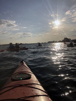 kayaking on the river at sunset