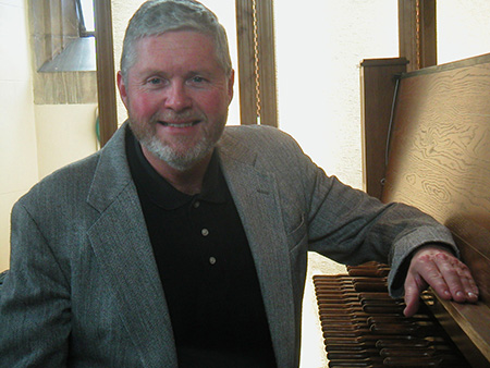 Ray McLellan at a piano