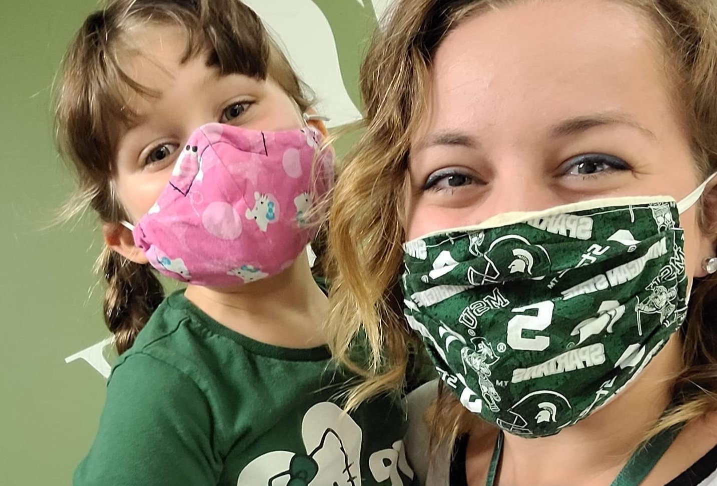 Kurajian with daughter wearing masks