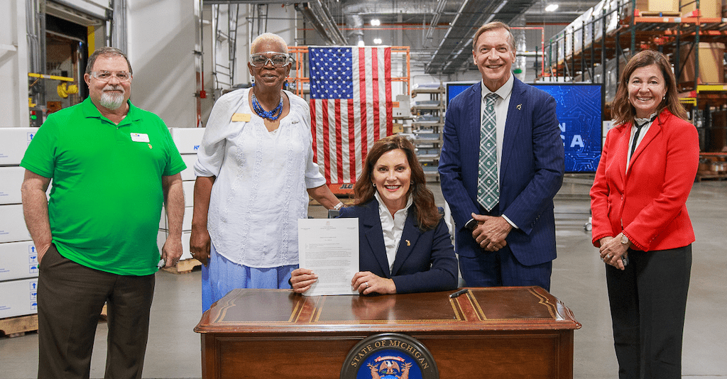 MSU President Samuel L. Stanley Jr., M.D., poses with Michigan Gov. Gretchen Whitmer, Saginaw Mayor Brenda Moore and other leaders during the CHIPS and Science Act ceremonial bill signing hosted by U.S. President Joe Biden in Saginaw, Michigan.