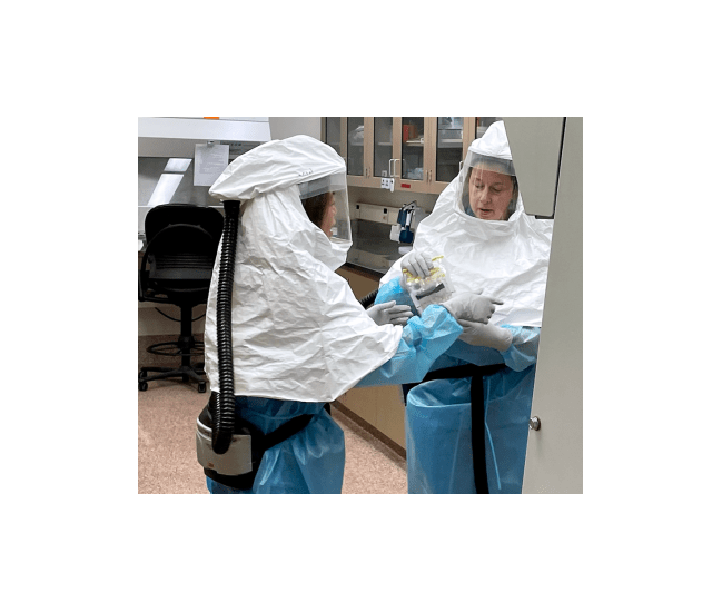Virology Section academic specialist Annabel Wise and section supervisor Danielle Thompson unpack samples collected from birds suspected to be infected with highly pathogenic avian influenza in the Laboratory’s biosafety level 3 area.
