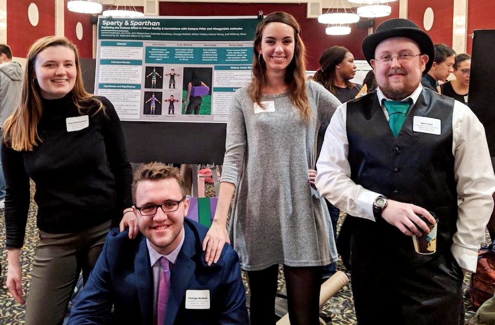 Ann Desrochers (top left) posing for a photo with fellow presenters at the 2019 University Undergraduate Research and Arts Forum 