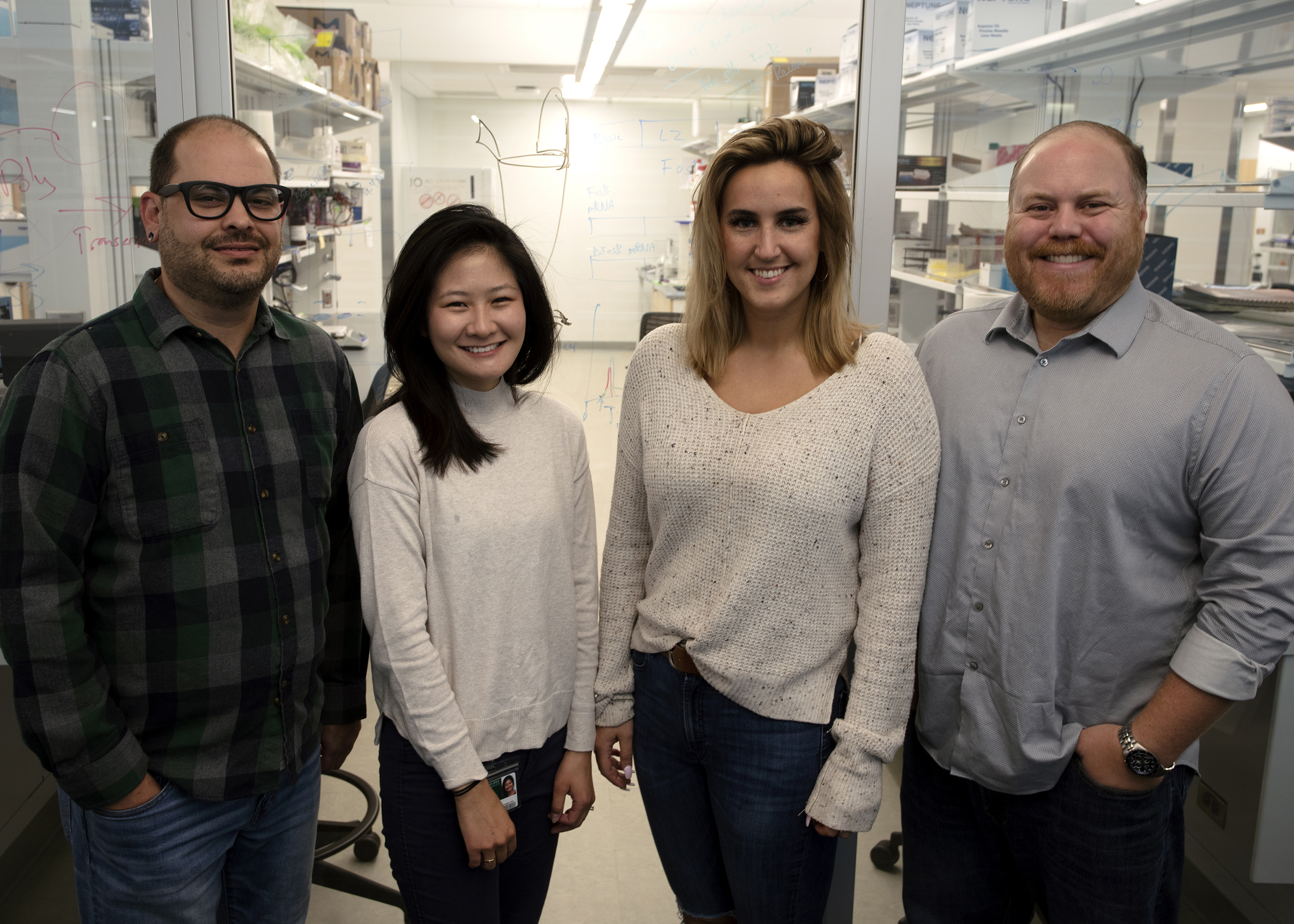 Left to right: Andrew Eagle and graduate students Chiho Sugimoto and Ivana Lakic work with A.J. Robison on sex differences in brain circuitry underlying vulnerability to depression. Credit: Ken Moon