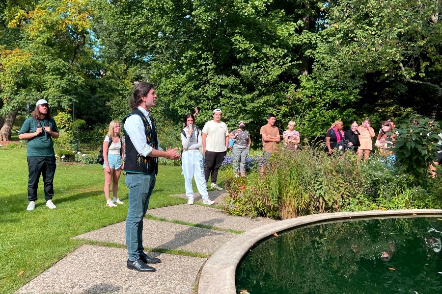 Elan Pochedley at MSU’s Beal Botanical Garden at an event where he was introducing Kaya DeerInWater for his “Neshnabé Ethnobotany” walk, an event that Pochedley helped organize. (Photo by Amy DeRogatis)