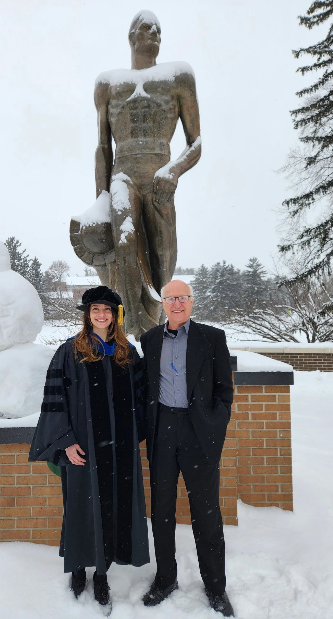 Yasi Zamani-Hank and her father, Bahram Zamani, in front of The Spartan Statue on Dec. 24. Photograph by Jeffrey Hank. 