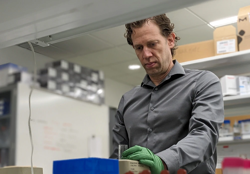 Bryan Smith working at a lab bench