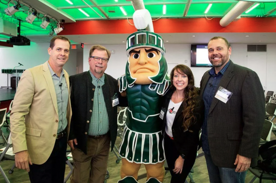 Larry Bell (second from left) poses for a photo at the 2018 MSU Detroit Executive Forum, where he was a speaker