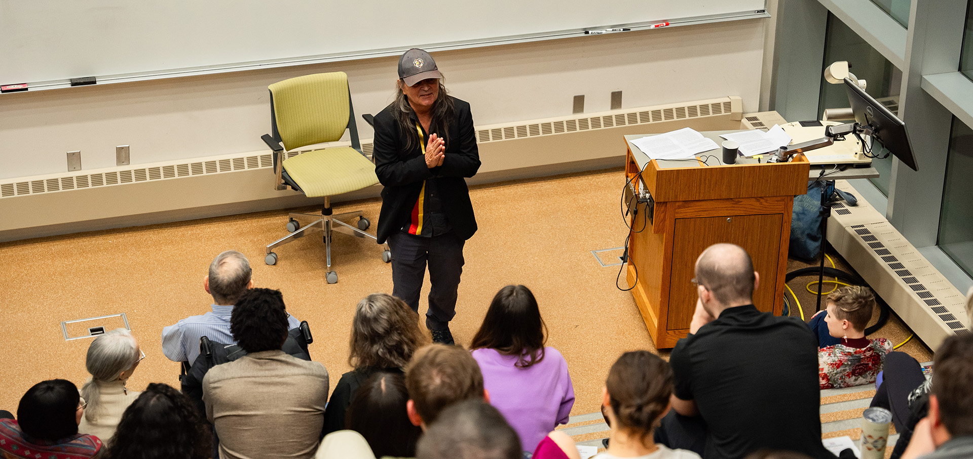 Gordon Henry speaking at poetry event.