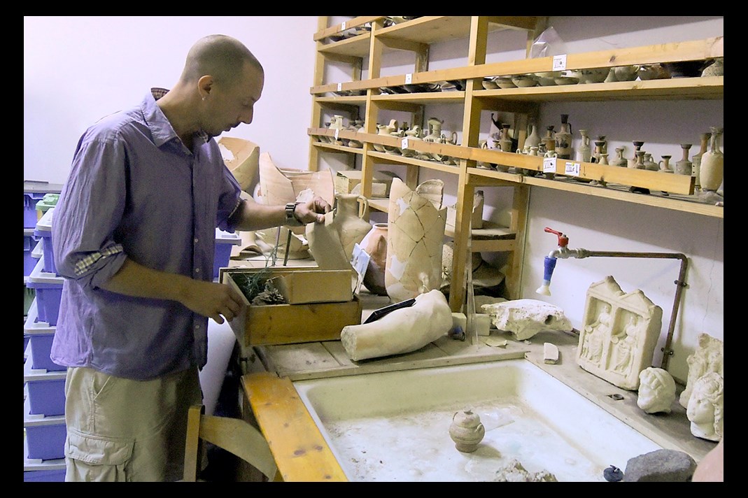 Jon Frey working with some of the artifacts in the collection at the MSU Excavations at Isthmia.