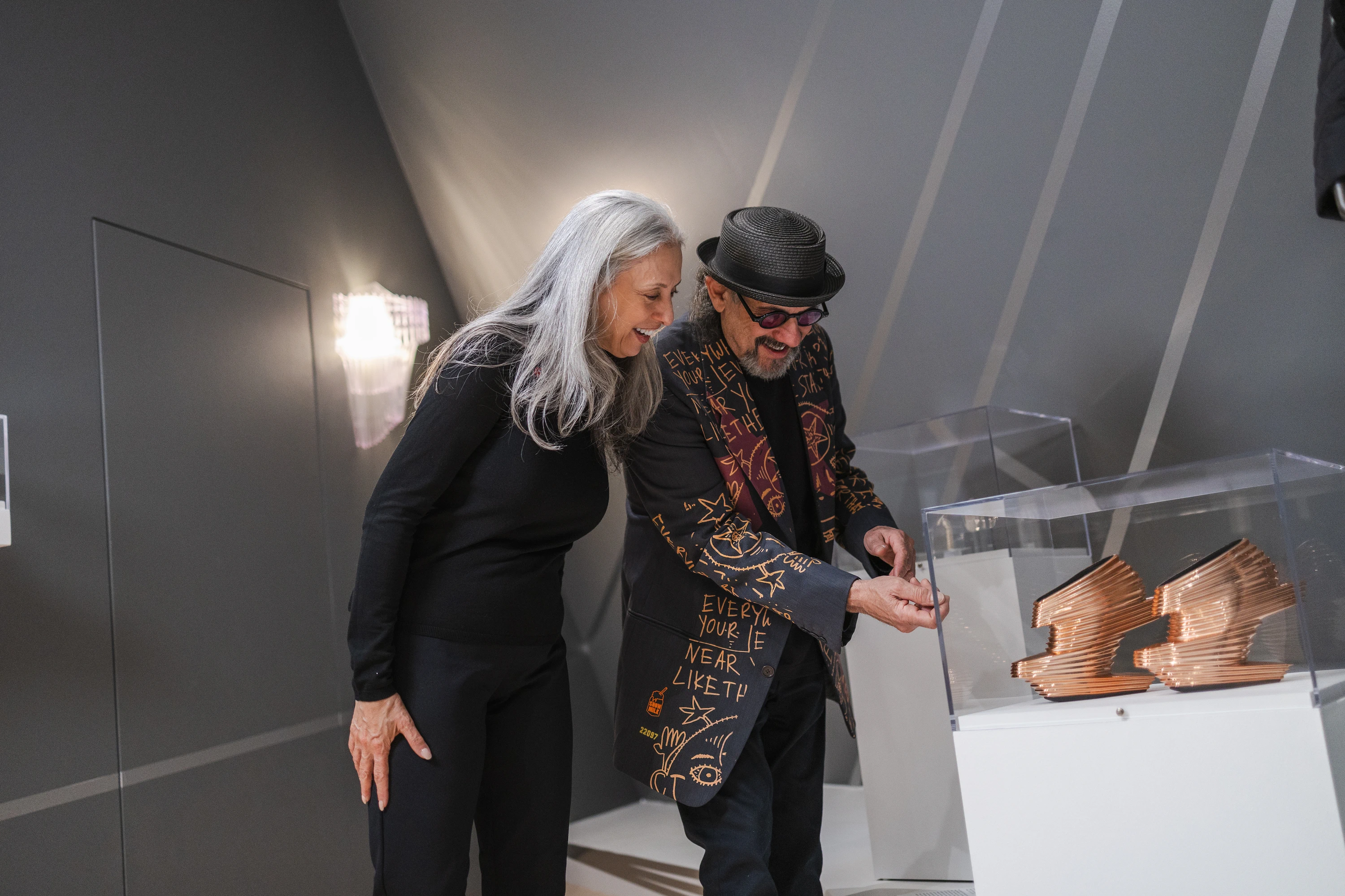 Alan and Rebecca Ross view the work Nova by Zaha Hadid Design for United Nude, gifted by the couple to the museum. 