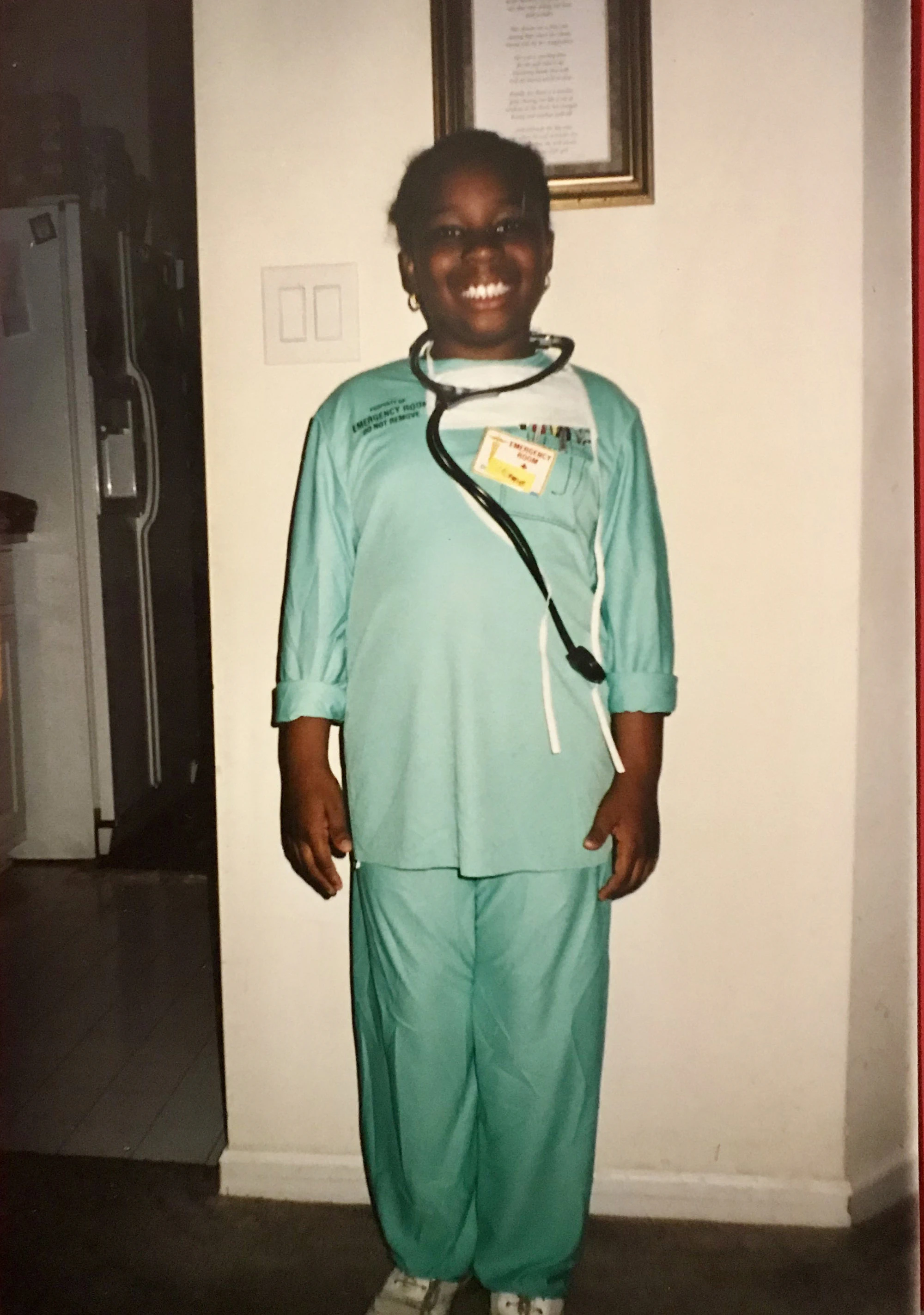 Childhood photo of Uyeh, dressed as a doctor