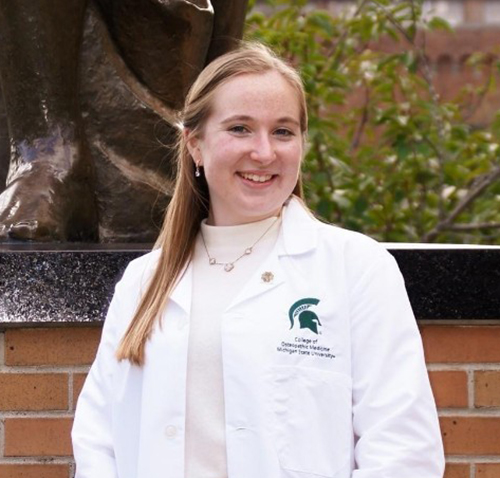 Abby Struble in front of Spartan Statue
