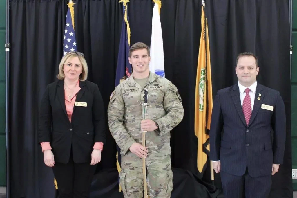 Sean Gordon receiving saber at ceremony