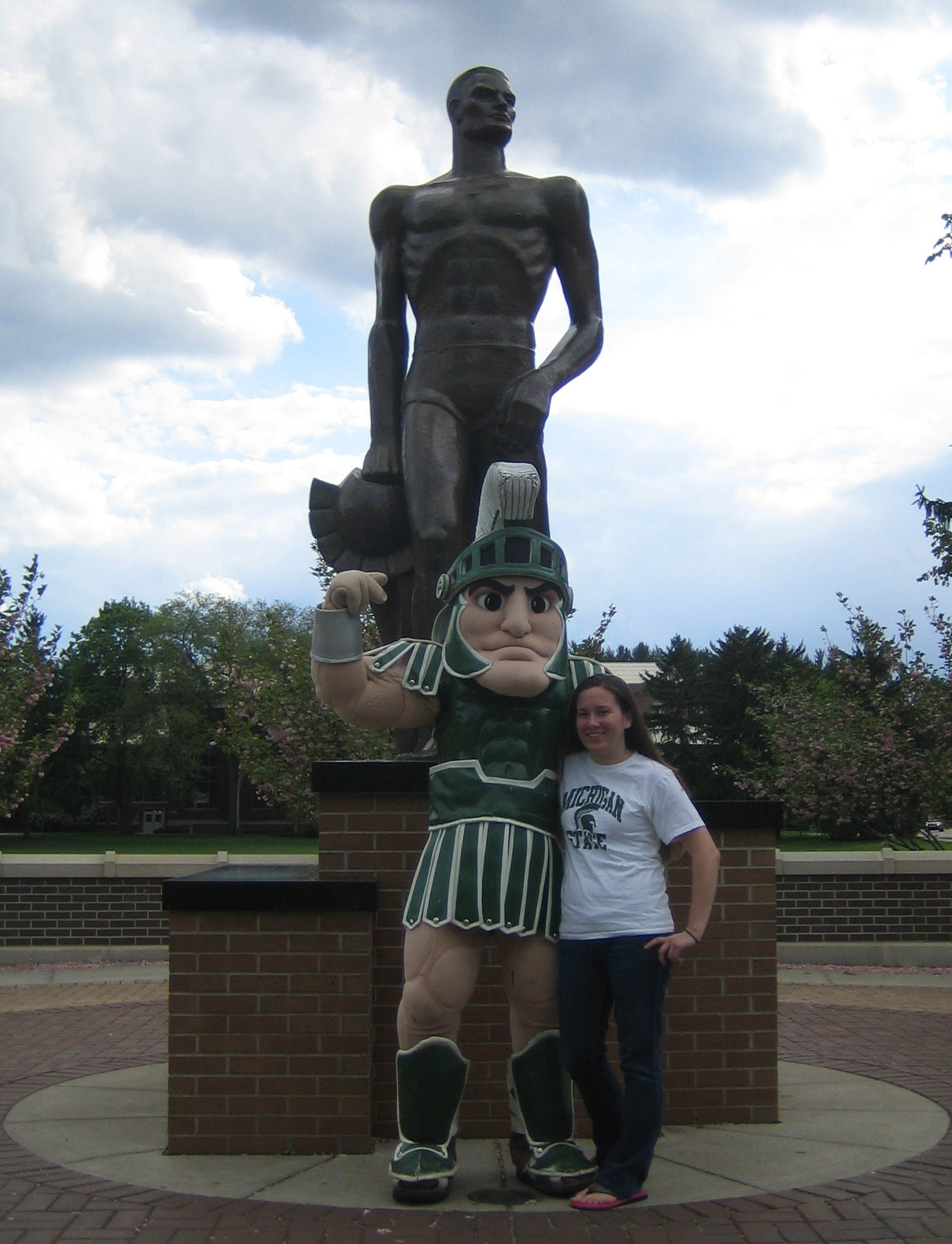 Karen Caldwell and Sparty mascot with Spartan statue