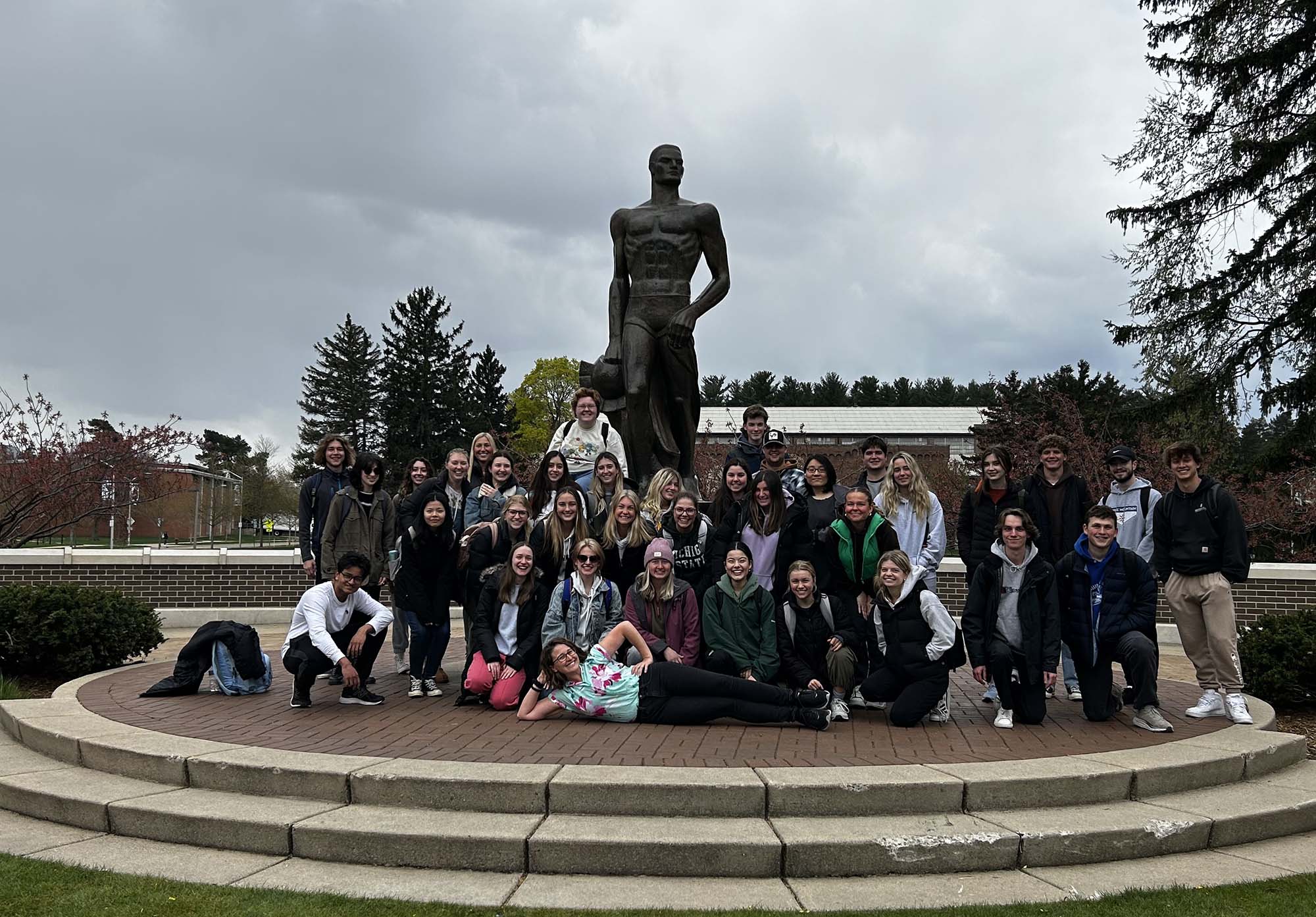Large group of students in front of the Spartan statue