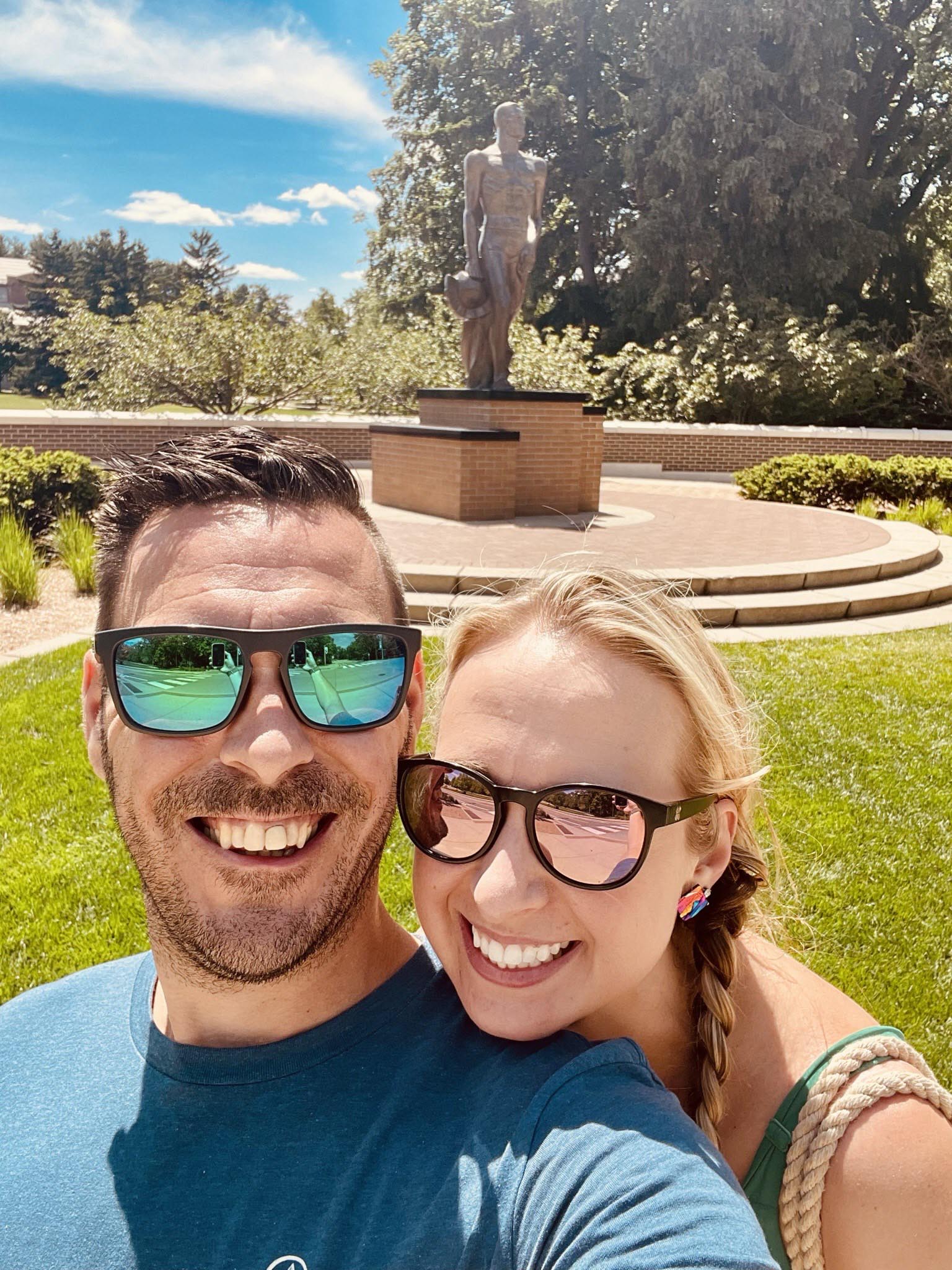 Selfie of Lisa Danno and her partner in front of the Spartan Statue