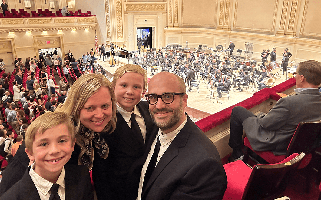 The Biedenbender family, (left to right) Declan, Angela, Izaak, and David, attended the wind ensemble premiere of David's piece River of Time at Carnegie Hall.