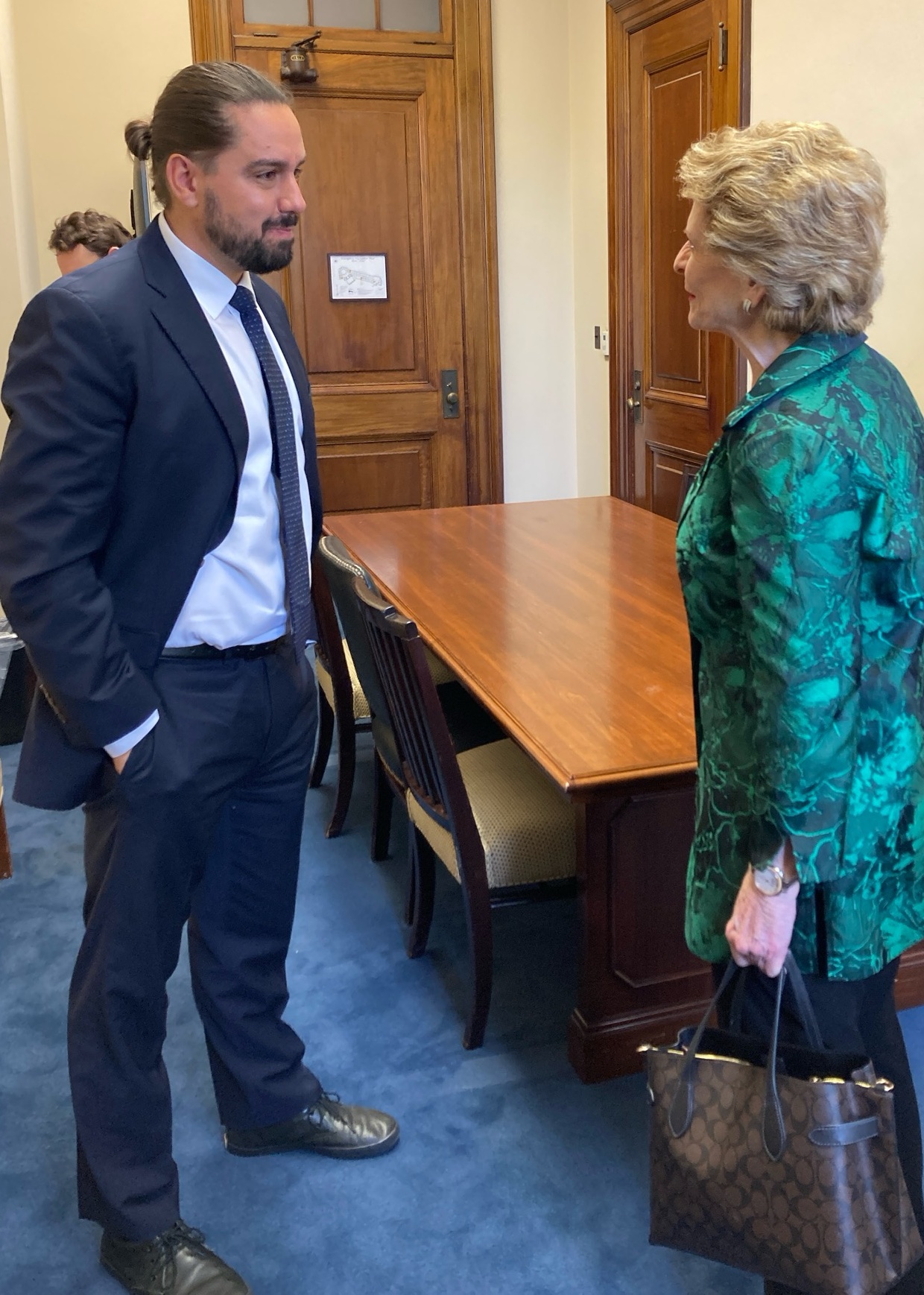 David Ortega talks with U.S. Sen. Debbie Stabenow.