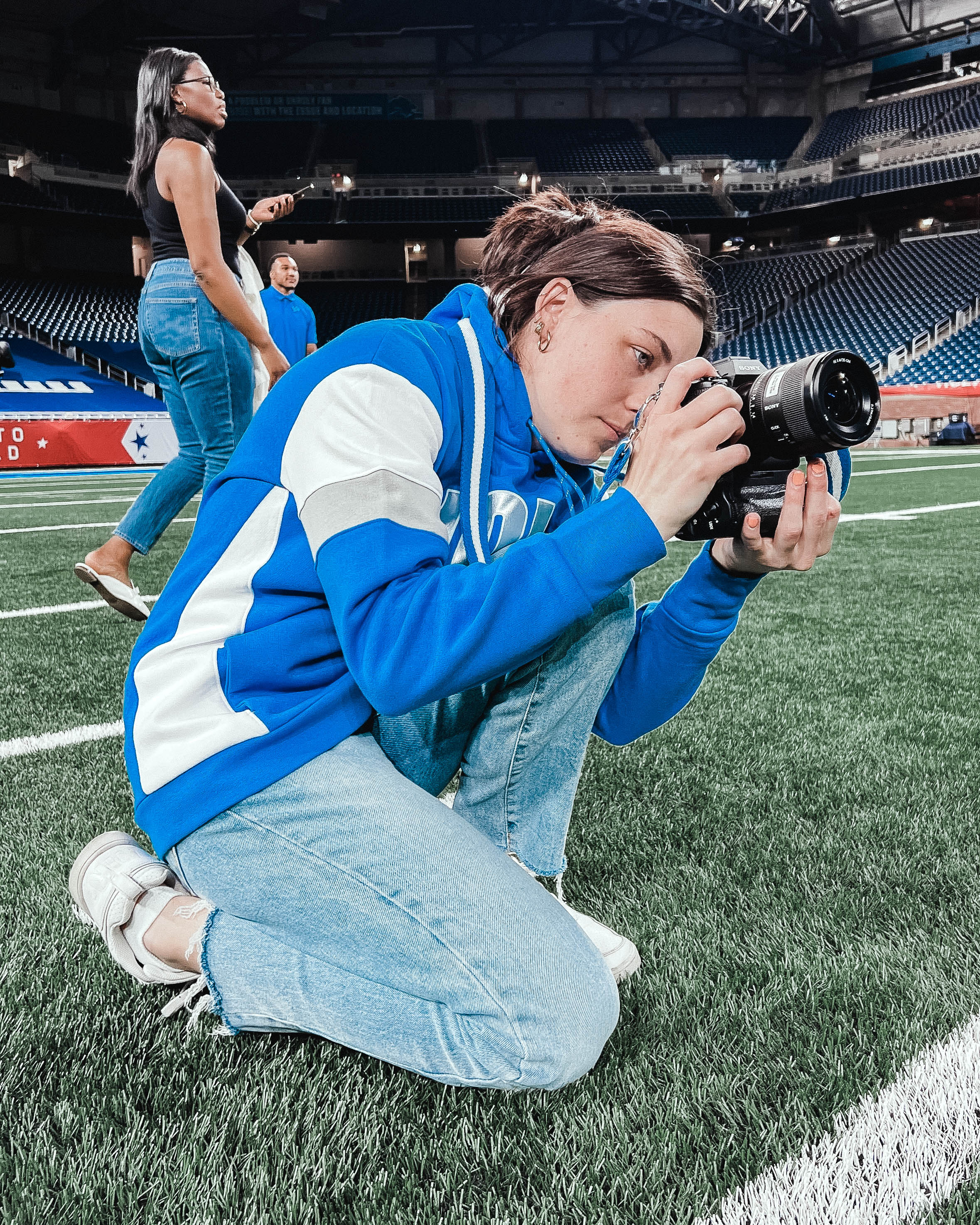 Katie Quinlan takes photos while on the field.