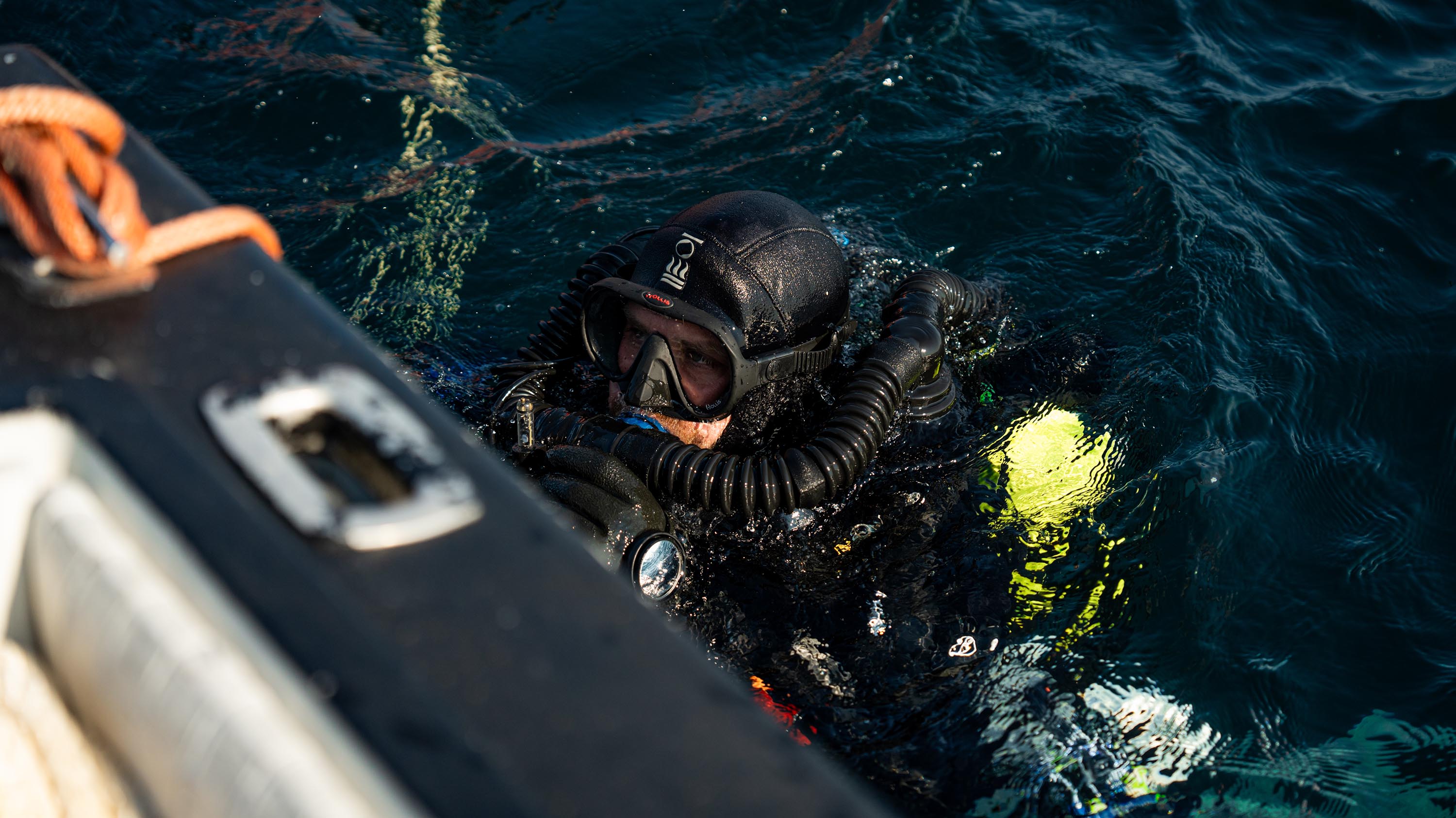 Diver emerging from water