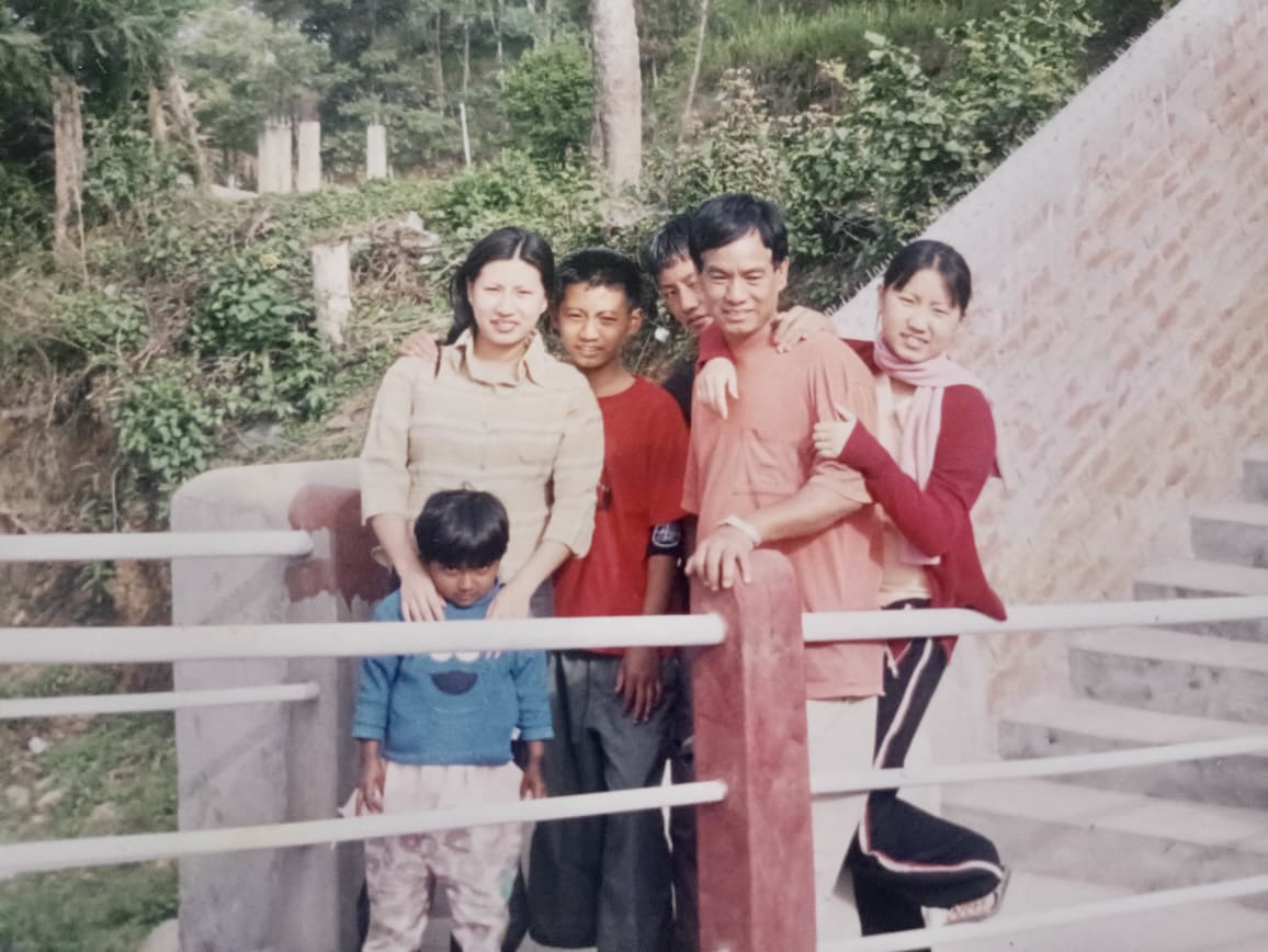 Left to right, little girl in blue (sister) Mharoni, sister Lily, Brother Longlenchum, brother Benri, Father Wozamo and me.