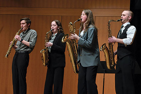 Winners of the 2023 competition, Clap 7 Saxophone Quartet perform before a live audience and panel of judges.