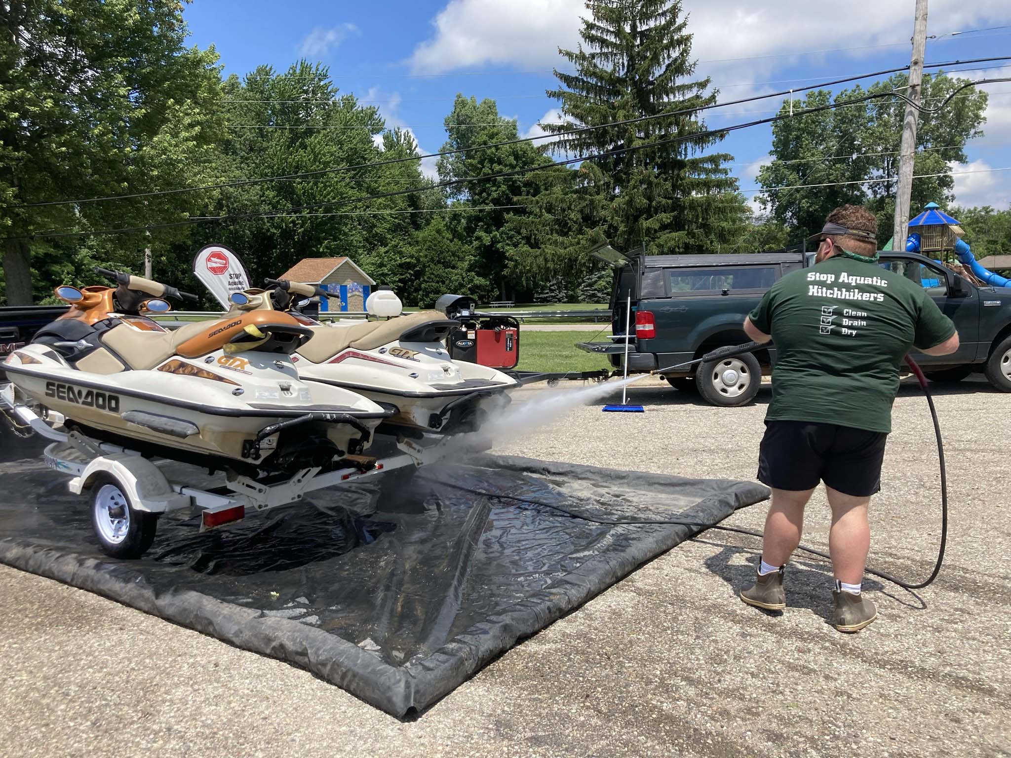Employee washing boat