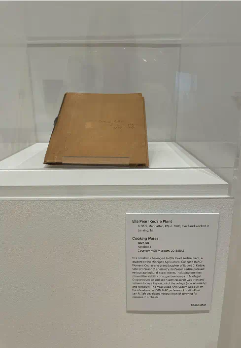 a closed notebook on a display pedestal