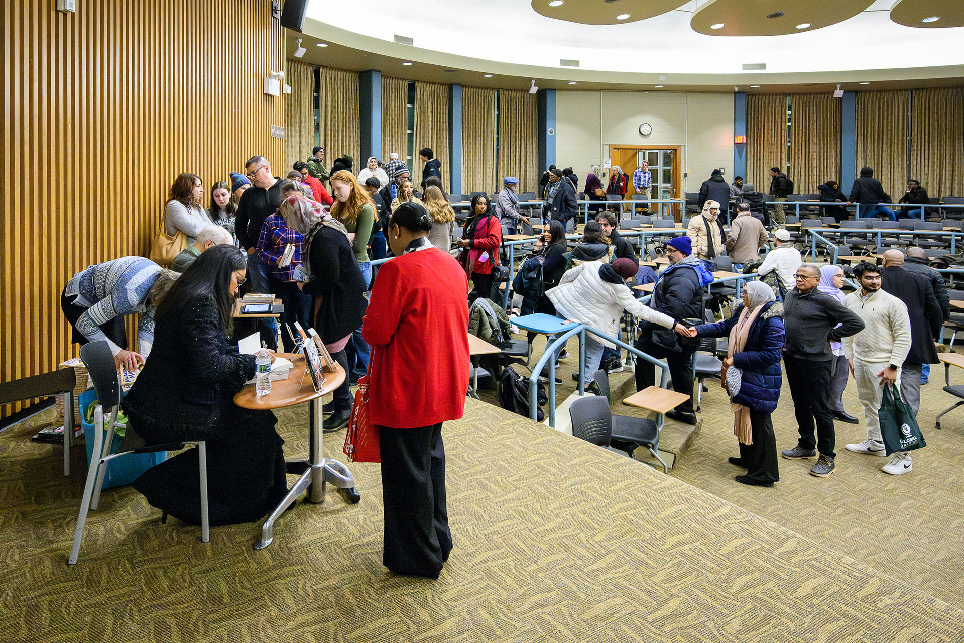 Attendees stand in line for a book signing with Ilyasah Shabazz