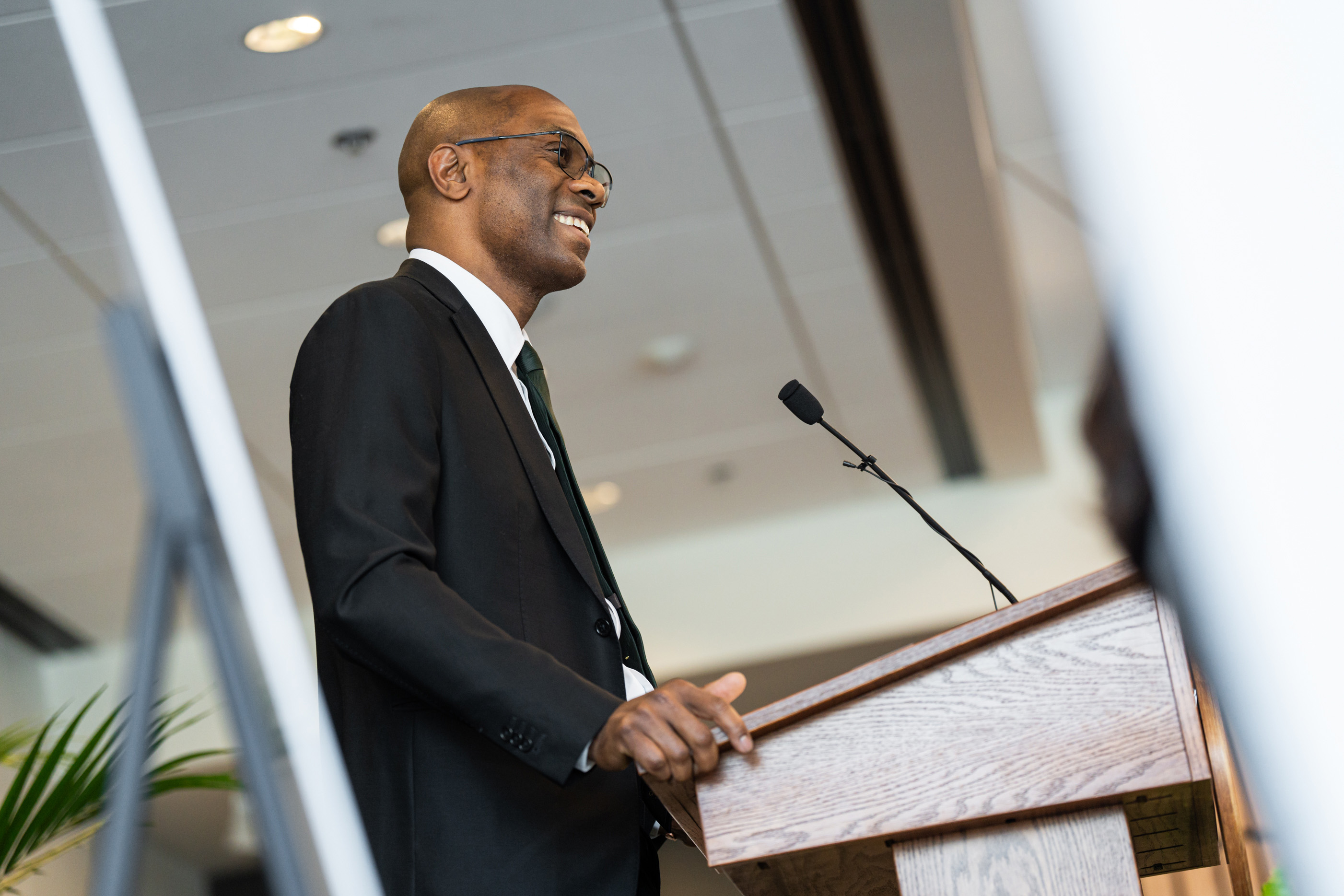 Jabbar Bennett speaking at the lectern