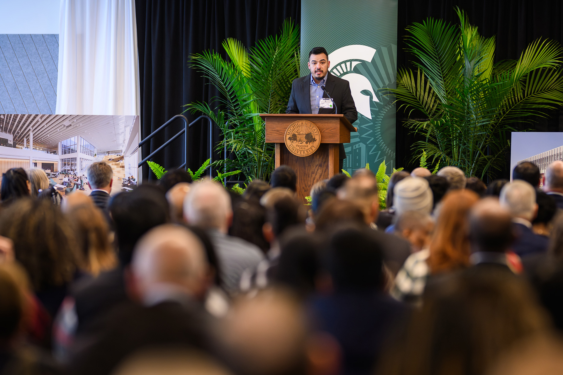 Samuel Saldivar speaking at the lectern