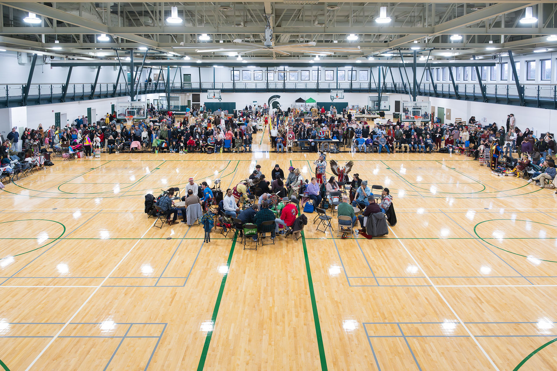 Powwow drummers in the center of the floor