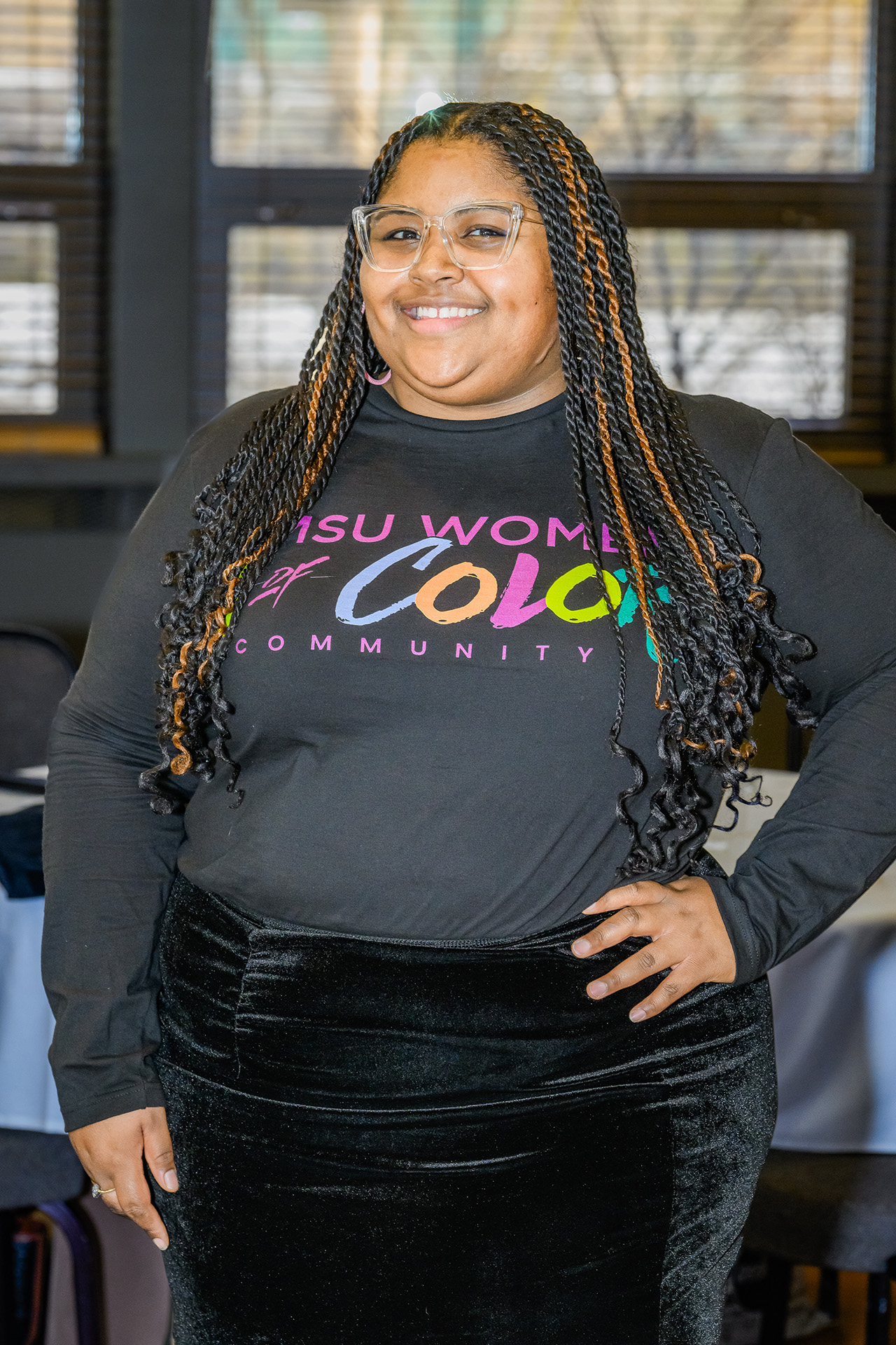 Attendee poses with hand on hip