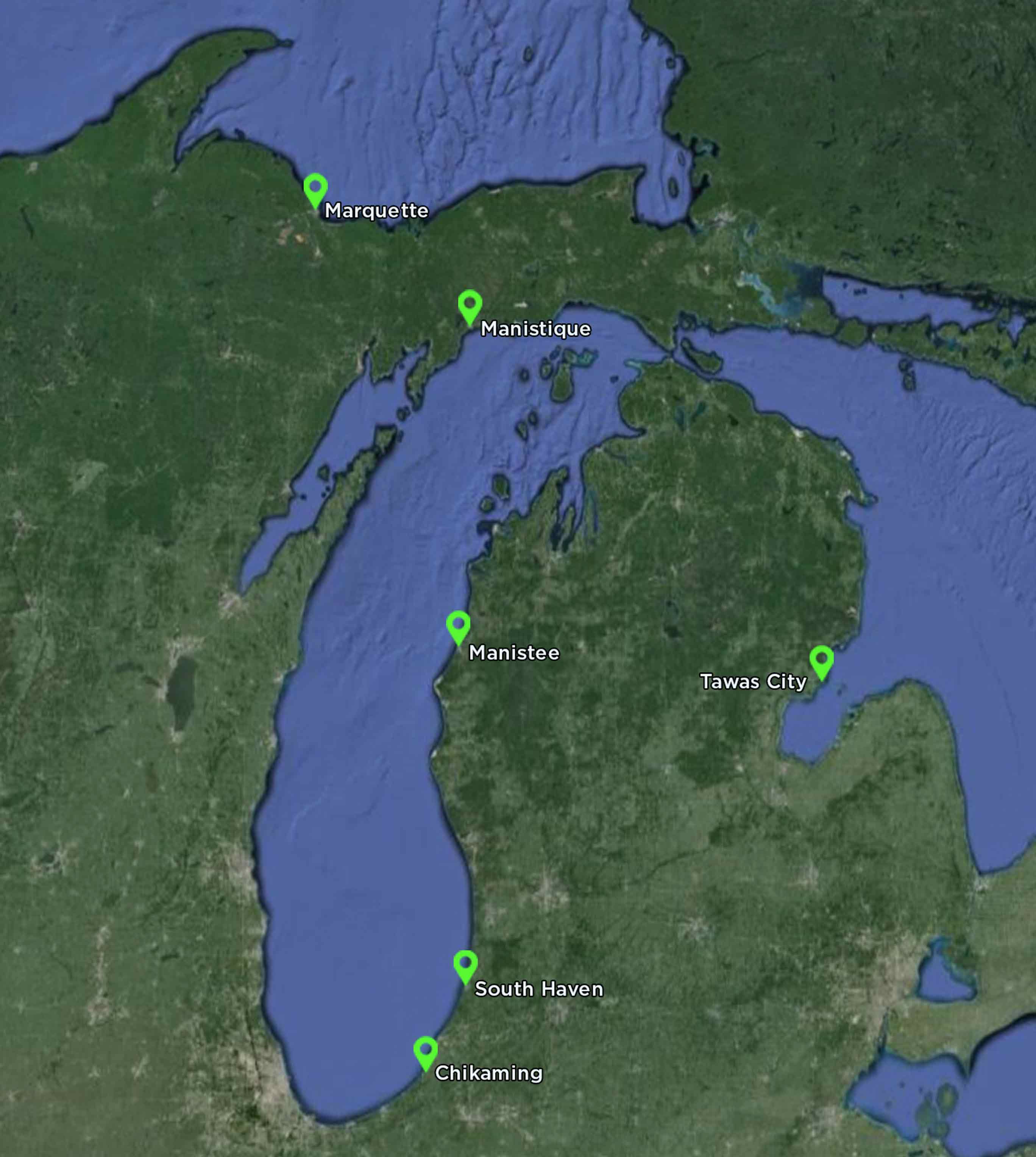 Satellite map showing various research locations along the Michigan lakeshore, marked with green pins, including Manistique, Manistee, South Haven, Chikaming, and Tawas City, representing key points of interest for water research studies in the Great Lakes region.